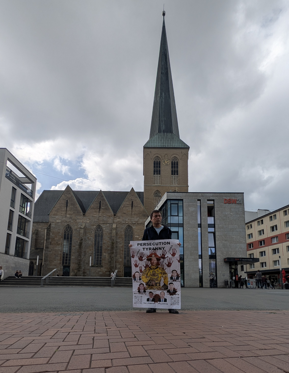 Protesting against the Chinese Communist Party's authoritarianism and Xi Jinping's dictatorship at St. Petri Church in Dortmund, Germany, on July 17, 2025.