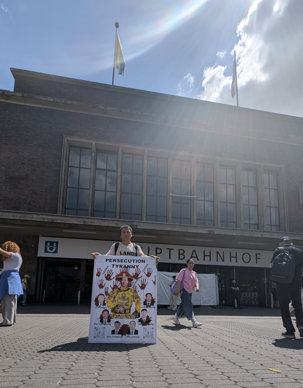 Protesting against the Chinese Communist Party's authoritarianism and Xi Jinping's dictatorship at the central train station in Düsseldorf, Germany, on July 3, 2025.